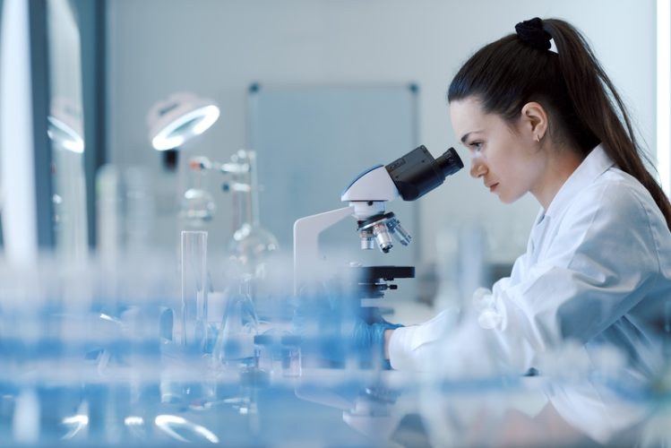 Young,Female,Researcher,Working,In,The,Lab,,She,Is,Examining
